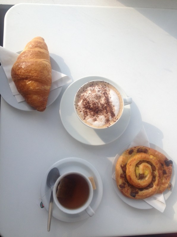 Croissant, Cappucino, apple and cinnamon tea and a pain au raisin